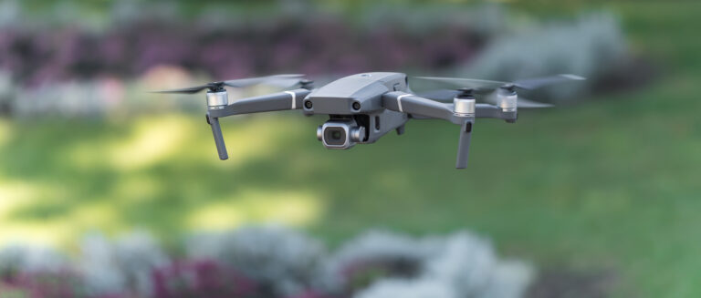 Drone Flying during the day in field of flowers at a park