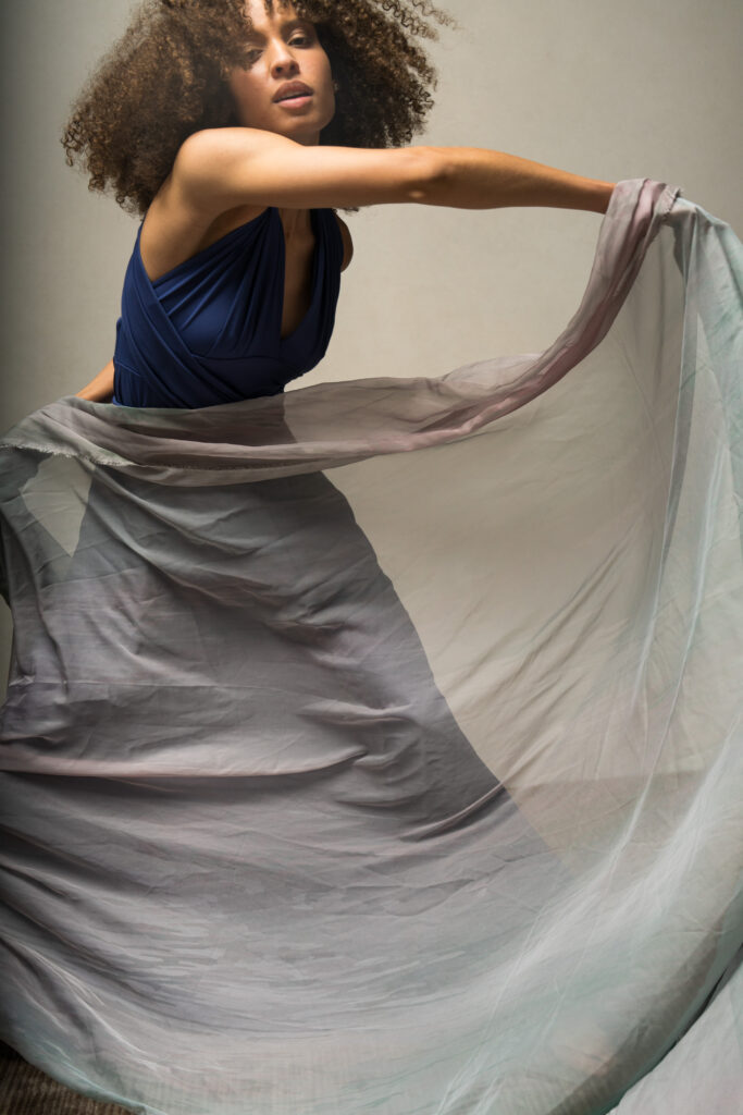 black model dancing with shawls