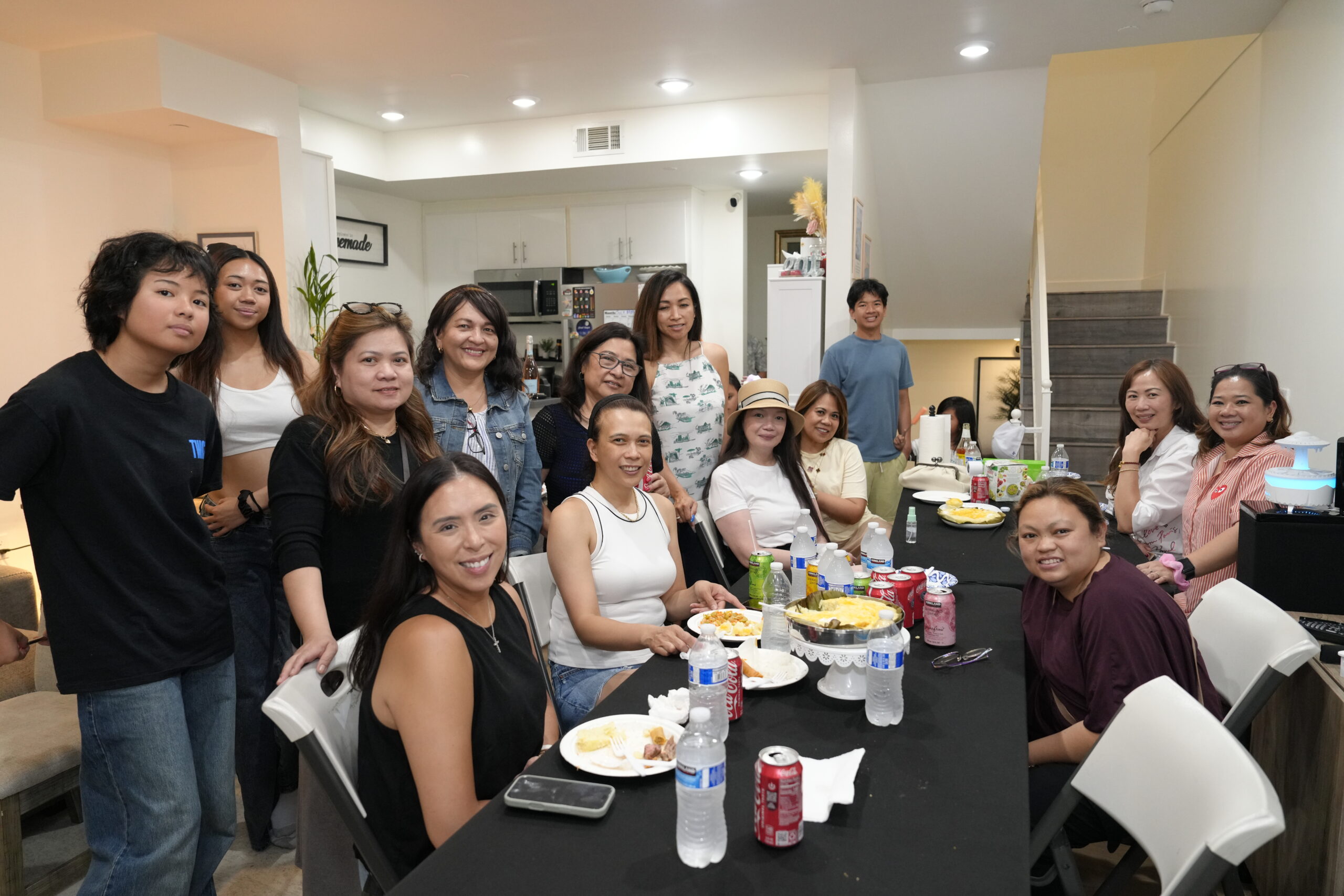 Family and friends celebrating a birthday party during High-Tech Studios' Birthday & Family Photography Services